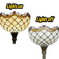 Stained glass torchiere lampshade shown glowing and unlit, with dark metal stem