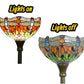 Stained glass torchiere lamp shade showing lights on and off on dark base.