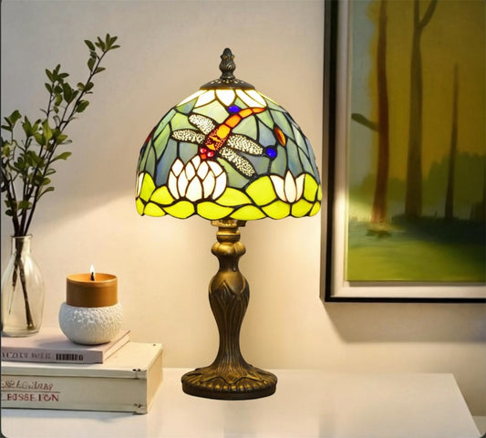 Stained glass Tiffany table lamp with multicolor shade and bronze metal stand