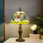 Stained glass table lamp with multicolor floral shade and bronze-style metal base