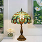 Multicolor stained glass table lamp with scalloped shade and bronze metal base