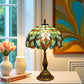 Multicolor stained glass table lamp with brass-toned base and scalloped shade