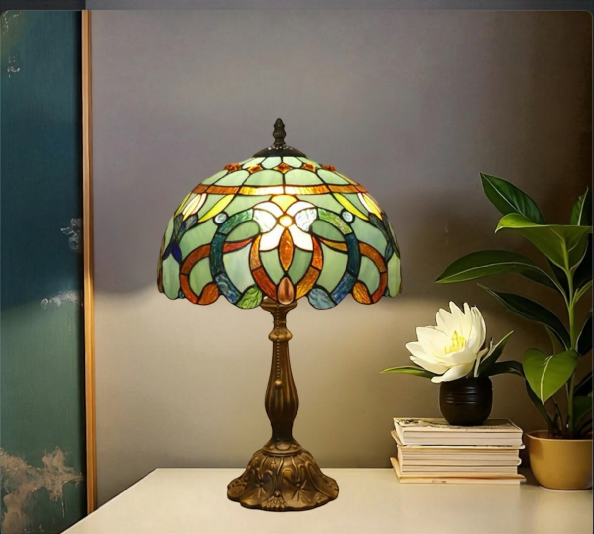 Multicolor stained glass table lamp with decorative bronze base and floral shade pattern