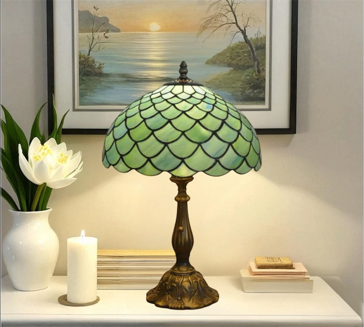 Tiffany-style table lamp with green stained-glass shade and bronze pedestal base