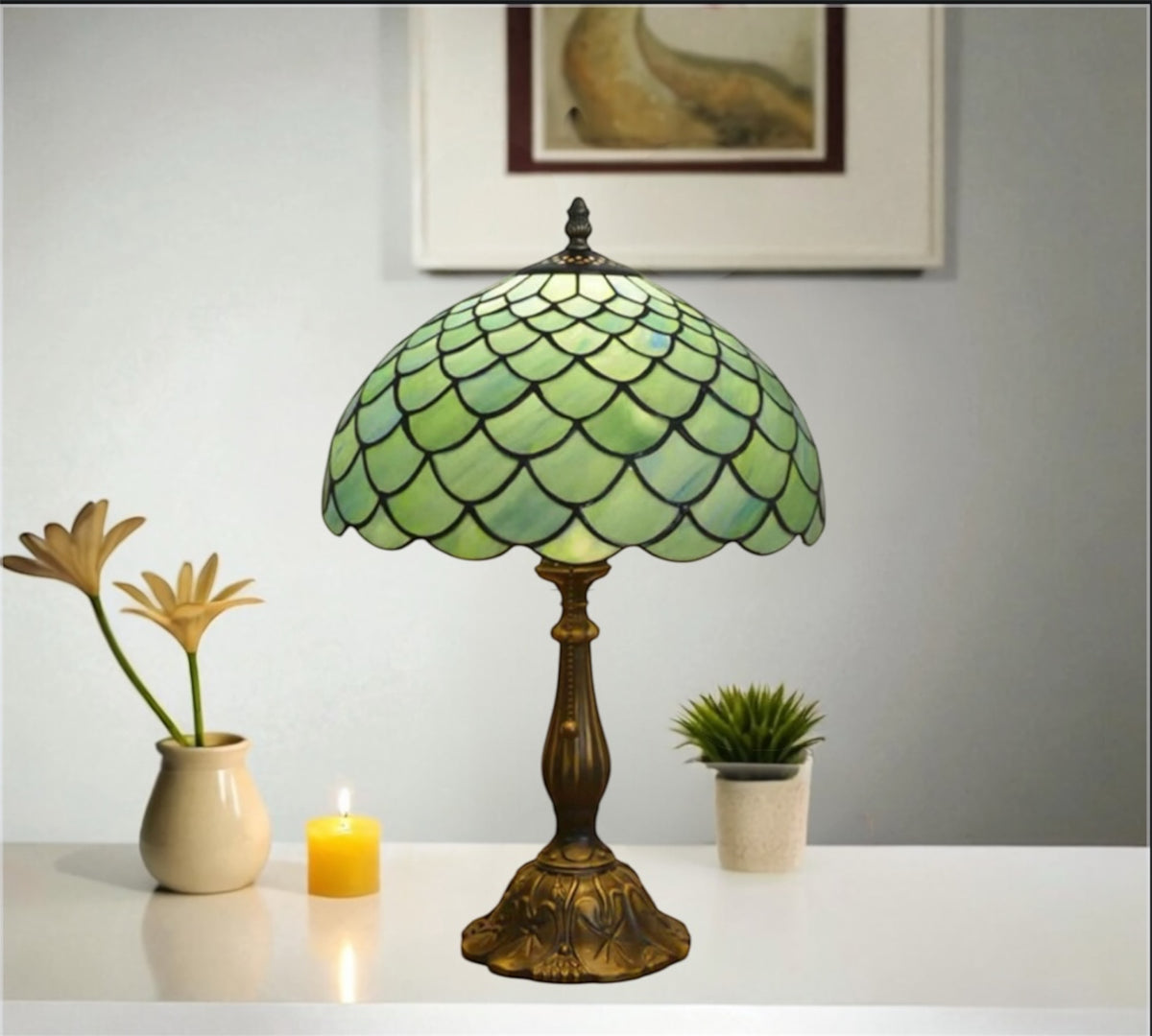 Tiffany-style table lamp with green stained-glass scalloped shade and bronze metal base