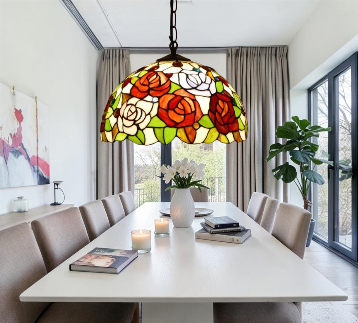 Stained glass pendant lamp with rose mosaic shade hanging from metal chain