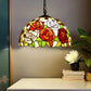Stained glass pendant lamp shade with rose floral pattern in red, orange, green, and white