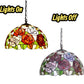 Two stained glass pendant lamp shades: red/orange roses and purple/gray floral designs