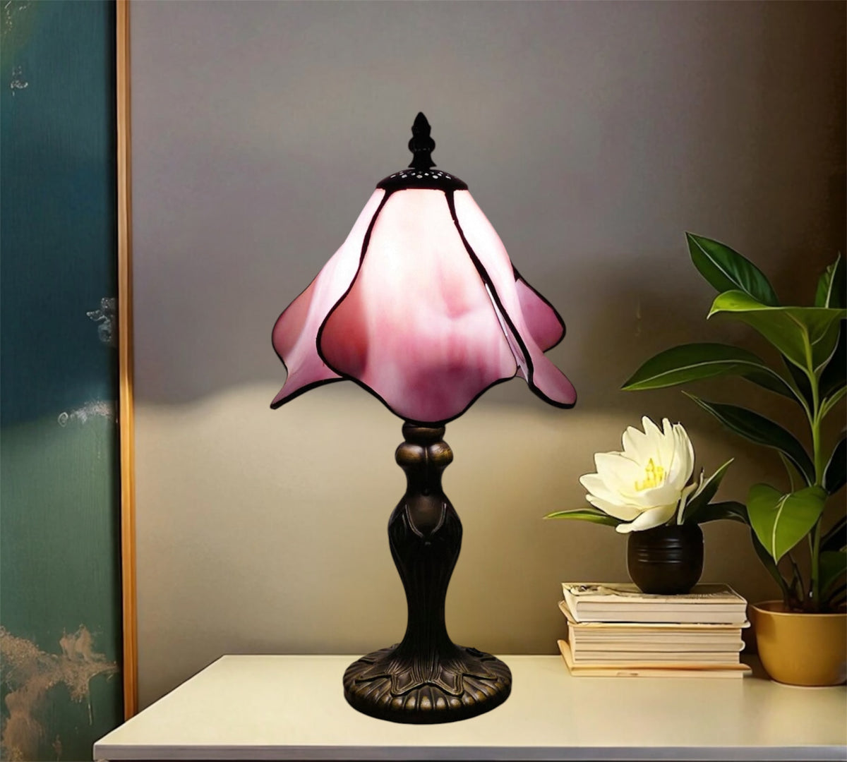 Tiffany style table lamp with pink stained-glass shade and dark metal base