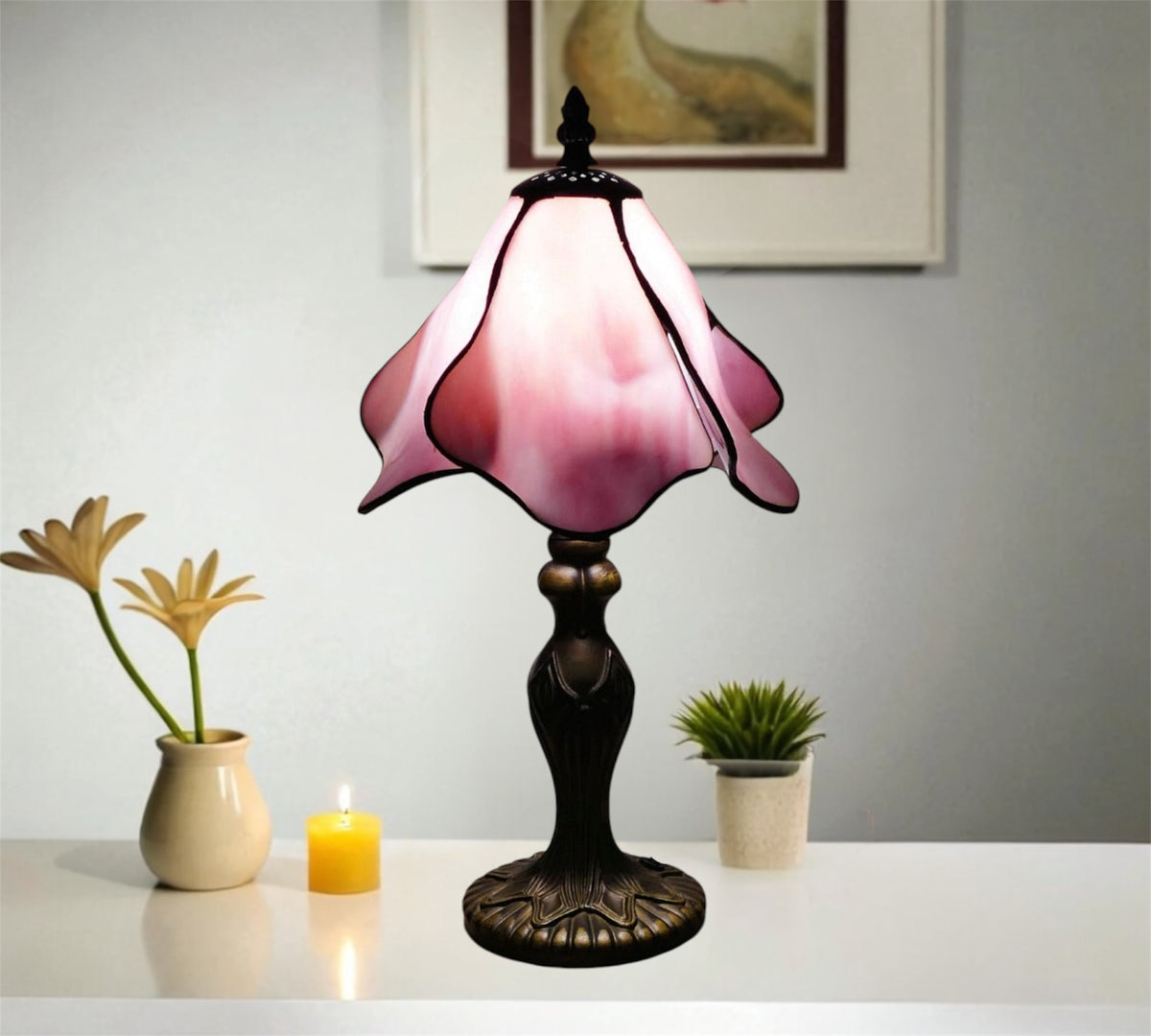 Pink stained-glass table lamp shade with petal edges and dark bronze base