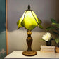 Tiffany table lamp with stained glass shade, yellow-green panels, metal base