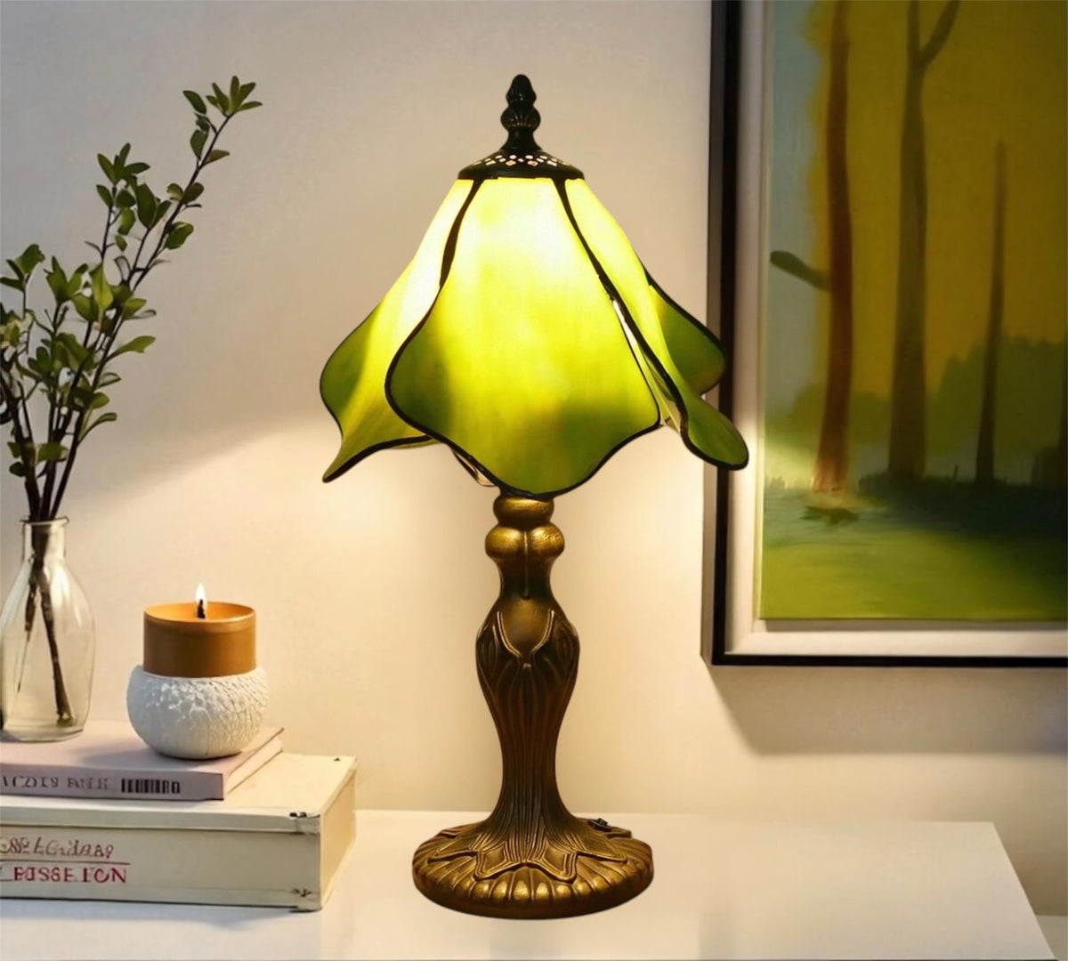 Tiffany table lamp with yellow-green stained glass shade and ornate metal base