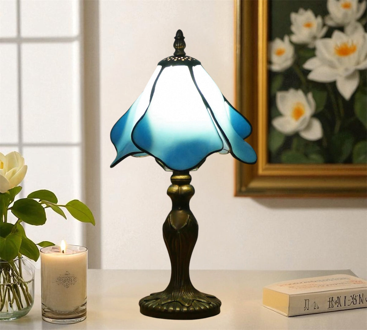 Blue stained glass Tiffany-style table lamp with bronze base and finial