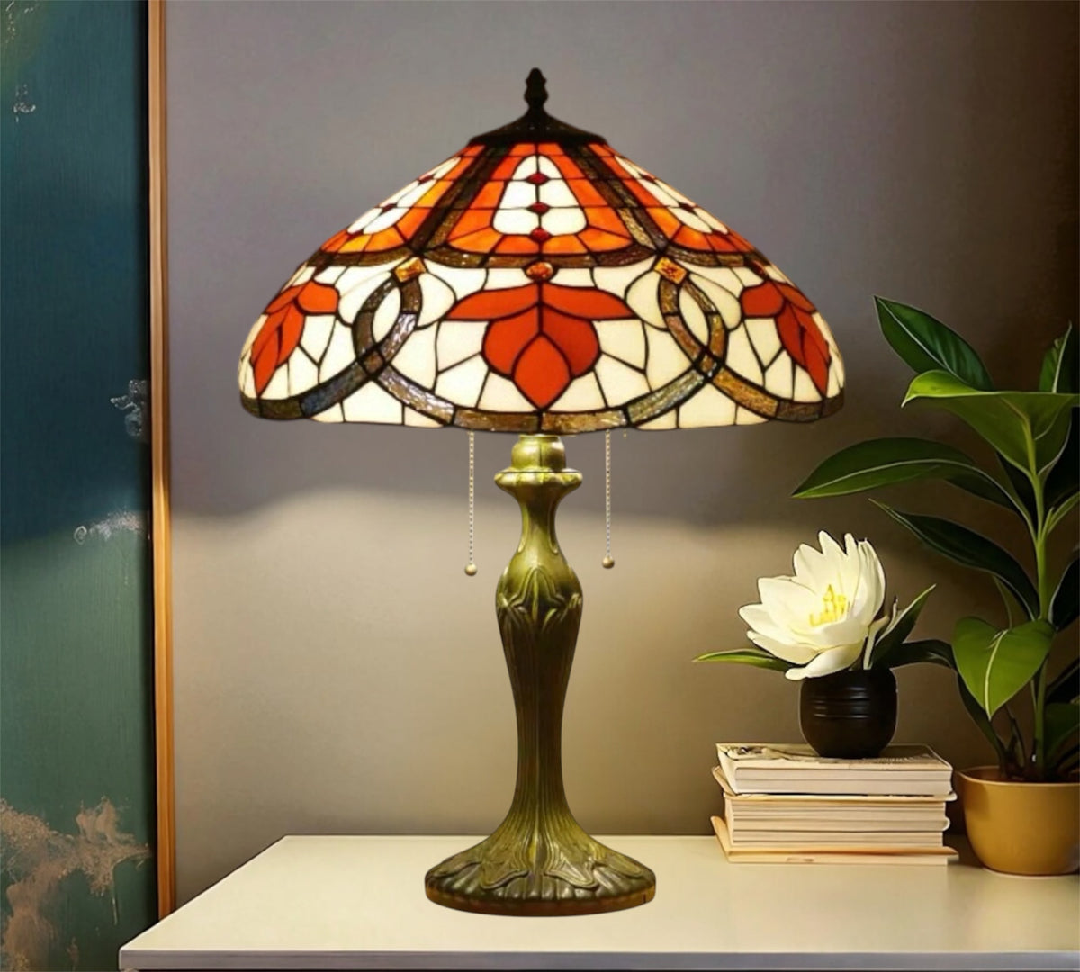 Tiffany table lamp with multicolor stained glass shade and bronze base on white surface