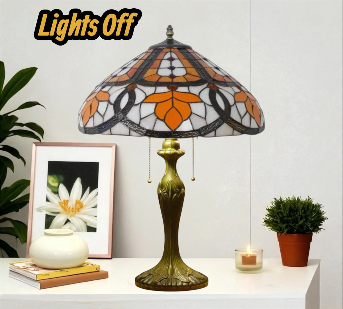 Tiffany table lamp with stained glass shade and bronze base, lights off