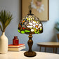 Stained glass table lamp with floral-like mosaic shade and bronze pedestal base