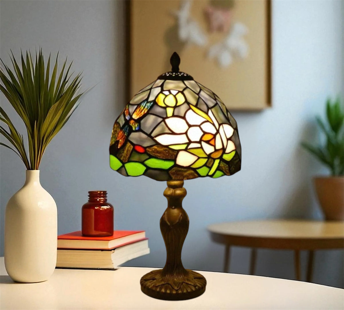 Stained glass table lamp with floral-like mosaic shade and bronze pedestal base