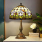 Tiffany-style stained glass table lamp with floral multicolor shade and bronze metal base