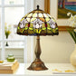 Tiffany-style stained glass table lamp with floral multicolor dome shade and bronze metal base