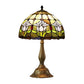 Tiffany-style stained glass table lamp with multicolor floral dome shade and bronze metal base