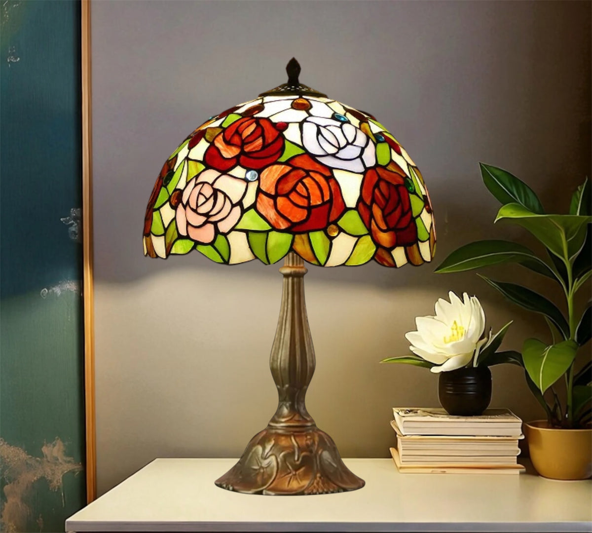 Three-quarter view Tiffany-style stained glass table lamp with floral shade and bronze metal base