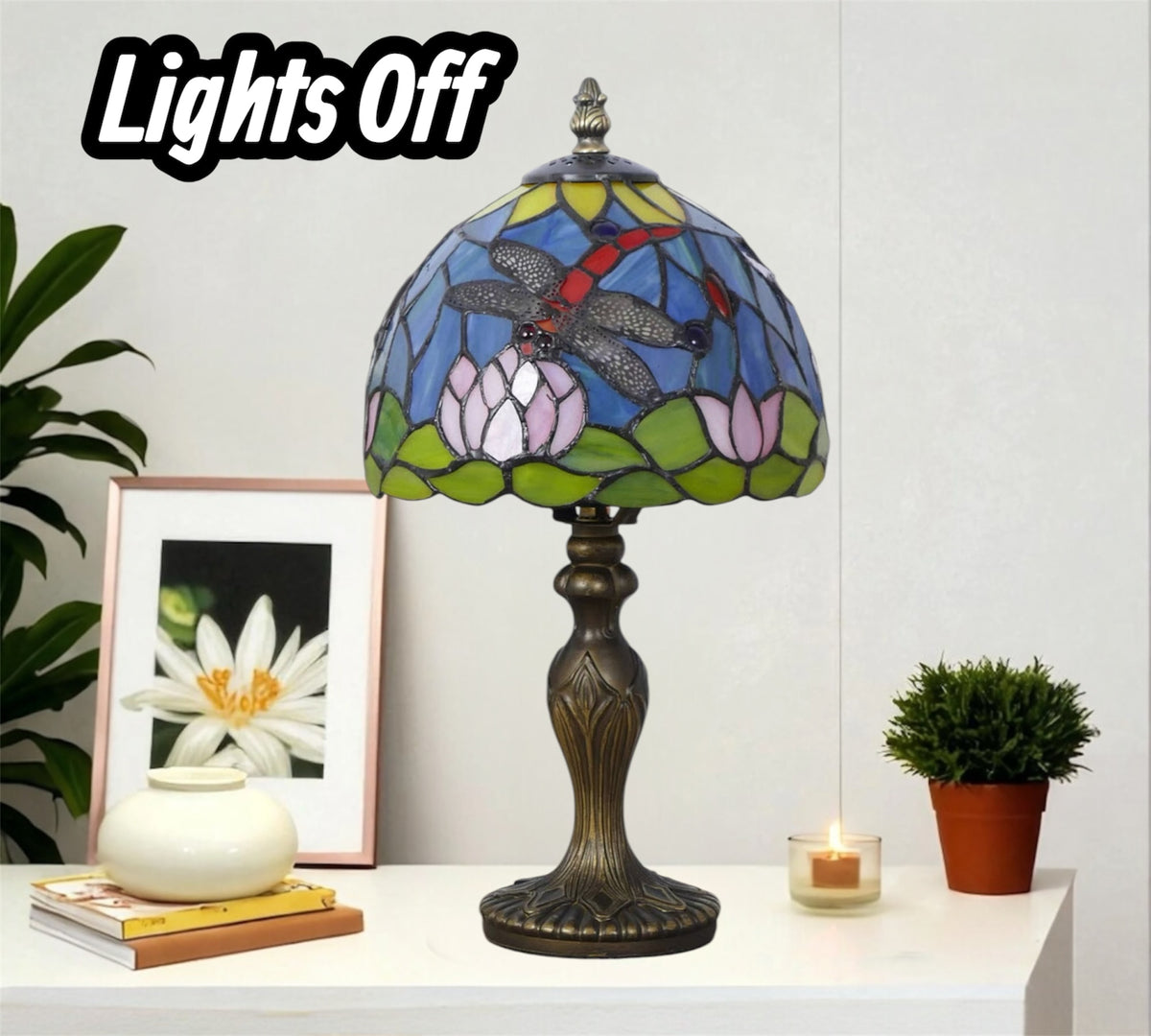 Stained glass table lamp with blue, green, and red mosaic shade on bronze pedestal base