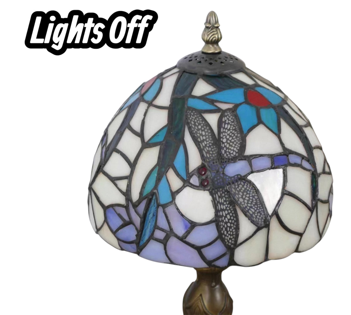 Close-up of unlit stained-glass dome shade with blue and gold accents on metal finial
