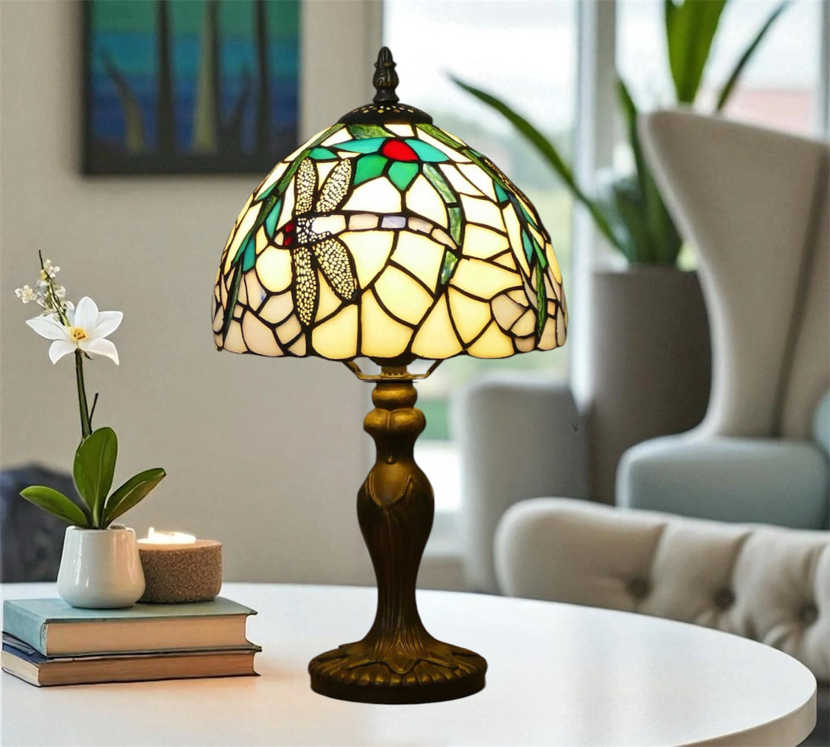 Tiffany table lamp with stained-glass dome shade and dark bronze pedestal base on table