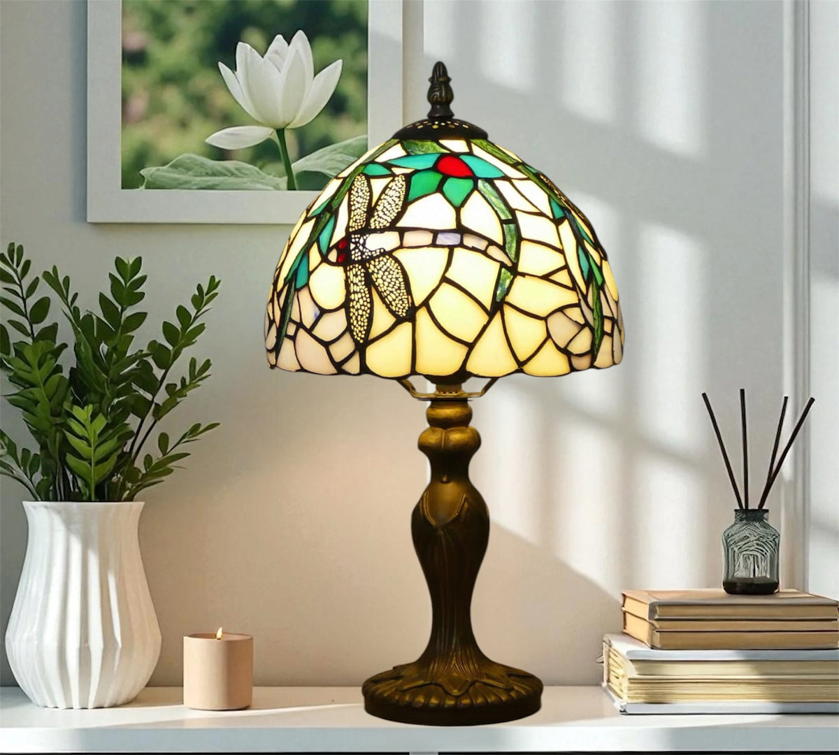 Tiffany table lamp with stained-glass dome shade and dark metal pedestal base