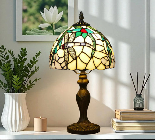 Tiffany table lamp with stained-glass dome shade and dark metal pedestal base
