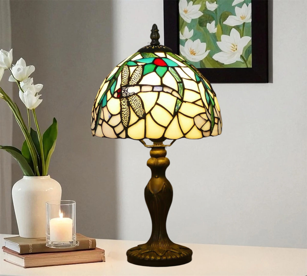 Side view Tiffany table lamp with stained-glass dome shade and dark metal pedestal base