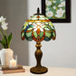 Stained-glass table lamp with multicolor shade and bronze pedestal base