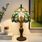 Stained-glass table lamp with rounded multicolor shade and bronze base