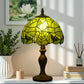 Green Tiffany table lamp with stained-glass dome shade and dark pedestal base