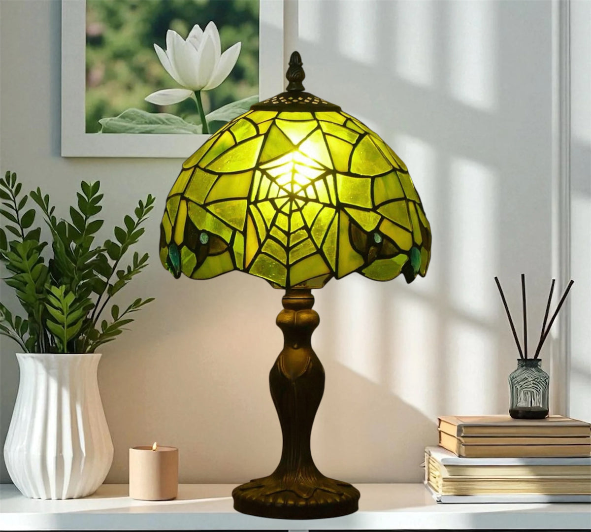 Green Tiffany table lamp with stained-glass dome shade and dark pedestal base
