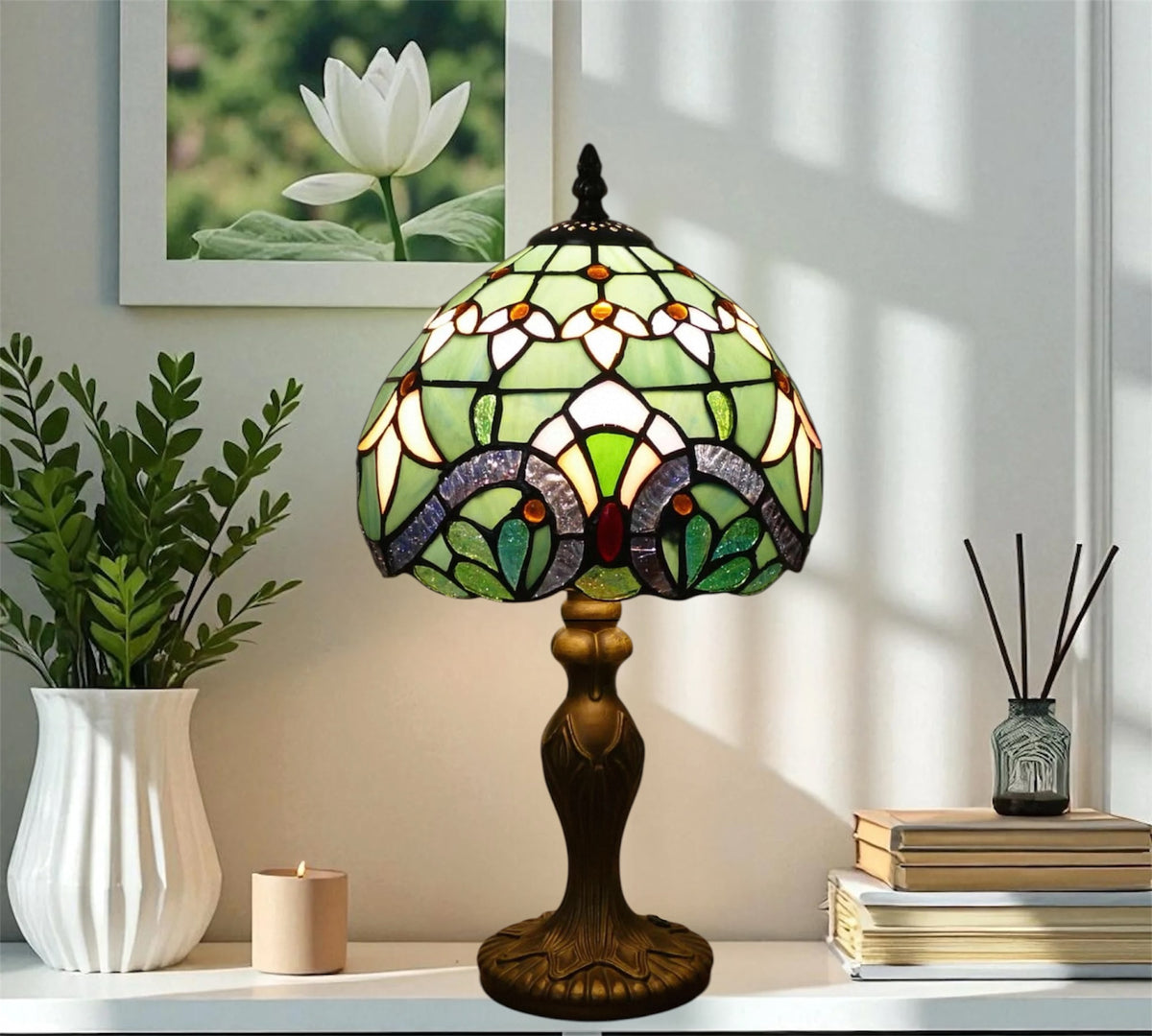 Stained glass table lamp with green floral shade and dark bronze metal base