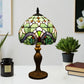 Stained glass table lamp, dome shade with multicolor panels and bronze base