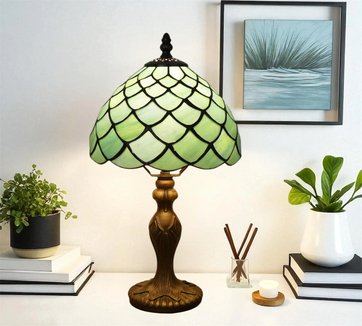 Green stained glass Tiffany-style table lamp with scalloped dome shade and detailed metal base