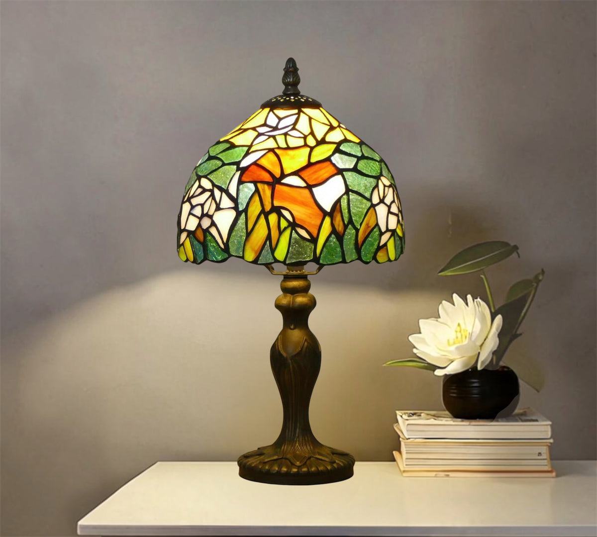 Stained glass Tiffany table lamp with multicolor floral shade and bronze metal base