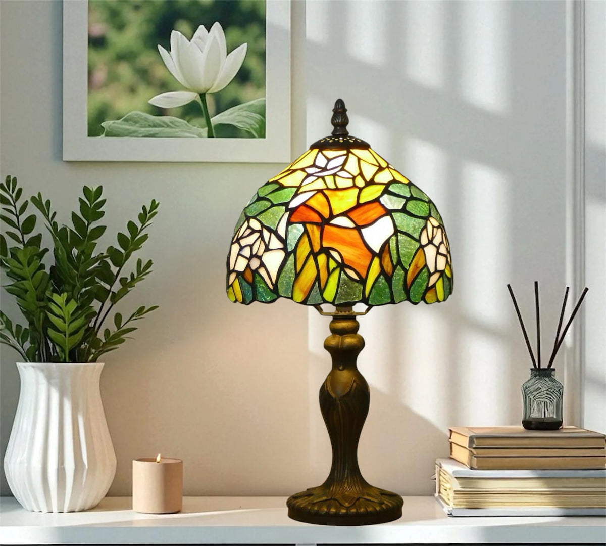 Tiffany stained glass table lamp with multicolor shade on bronze pedestal base