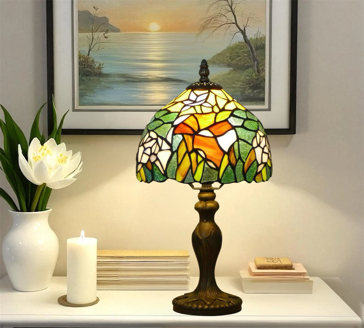 Tiffany-style stained glass table lamp with warm multicolor shade and bronze base on tabletop
