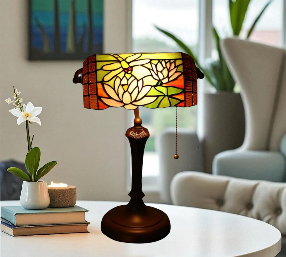 Stained glass table lamp with yellow floral shade panels and dark metal pedestal base