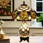 Tiffany-style stained-glass table lamp with amber, green, and blue shade