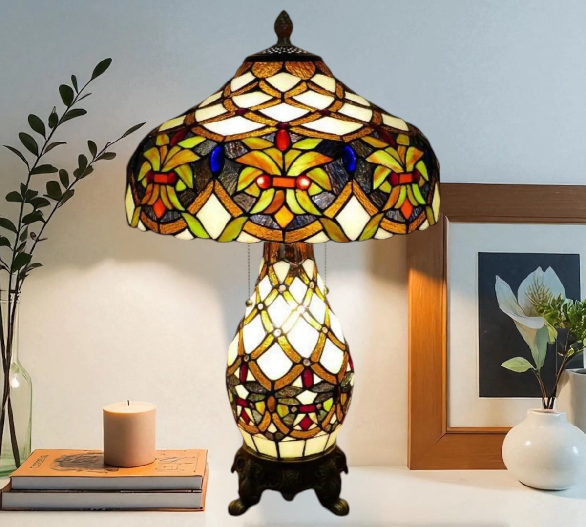 Tiffany-style stained-glass table lamp with domed shade and decorative resin stand
