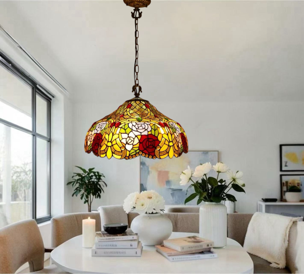 Multicolor floral stained-glass pendant lamp hanging above dining table