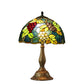 Tiffany table lamp with stained-glass grape shade and bronze metal base
