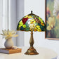 Tiffany table lamp with stained-glass grape dome shade on bronze pedestal base