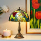 Tiffany table lamp with stained-glass grape dome shade and bronze footed base
