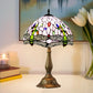 Dome stained-glass table lamp with multicolor pattern and bronze metal base
