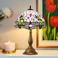 Multicolor stained-glass table lamp with bronze metal base and arched dome shade